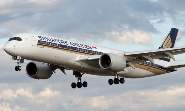 A Passenger Stealing Cash $120k From Overhead Bins on Singapore Airlines