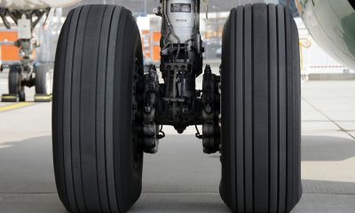 Why do airplane tires cause smoke at touchdown?