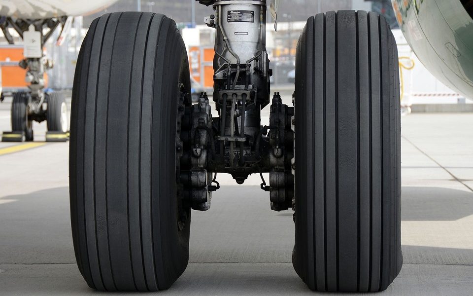 Why do airplane tires cause smoke at touchdown?